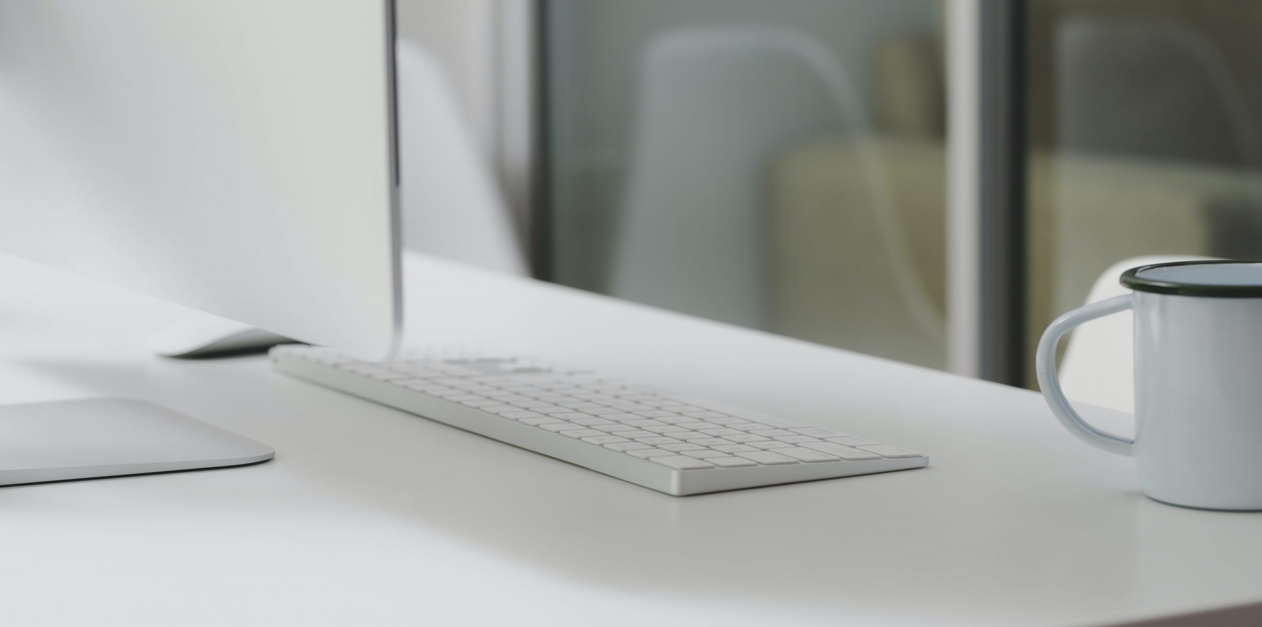 white-ceramic-cup-on-white-computer-table-3759122